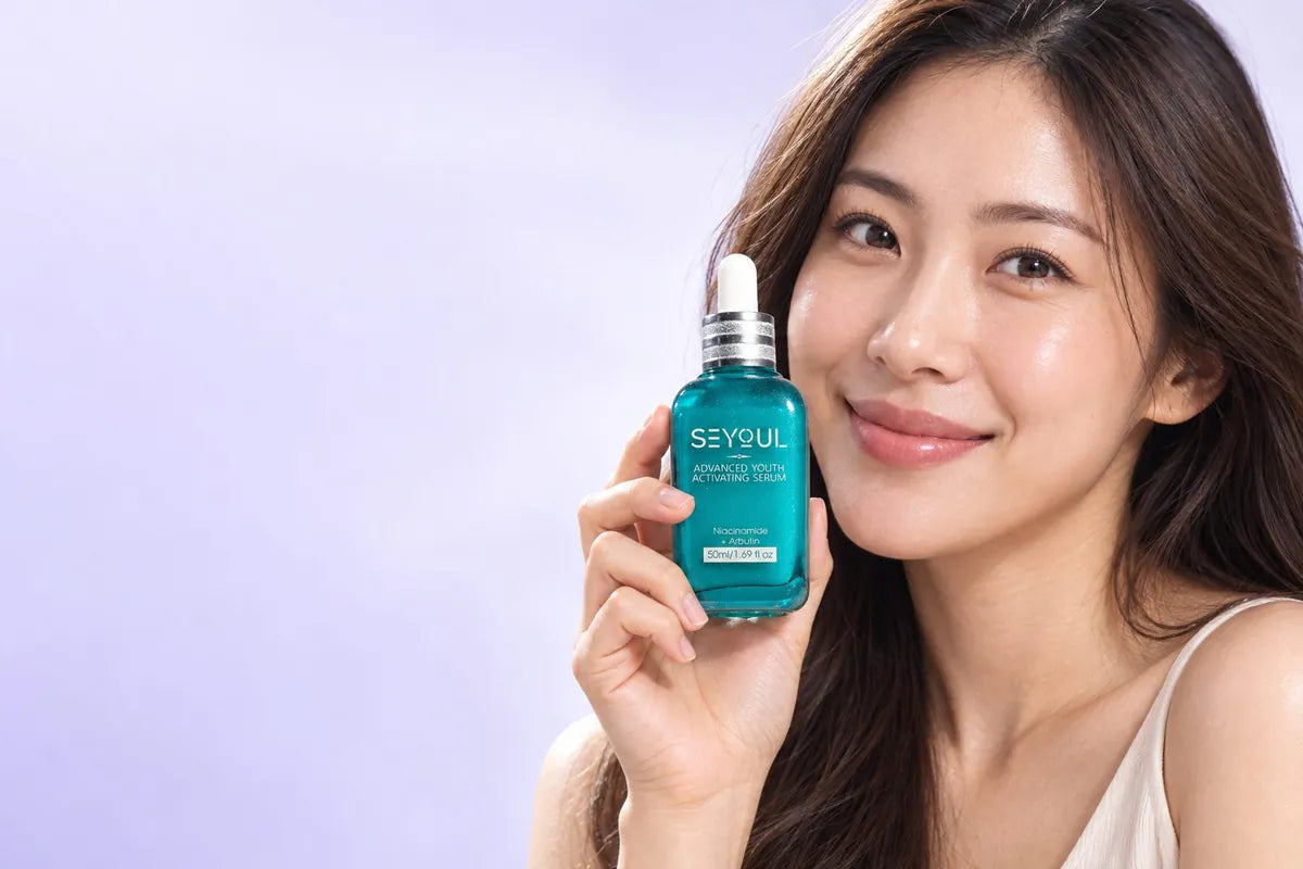 A woman holding the Advanced Youth Activating Serum